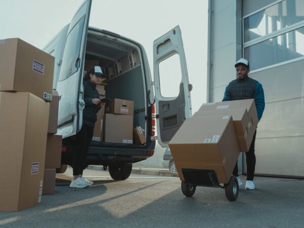 a man and a woman working for a delivery company