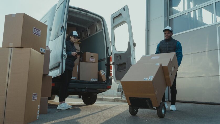 a man and a woman working for a delivery company